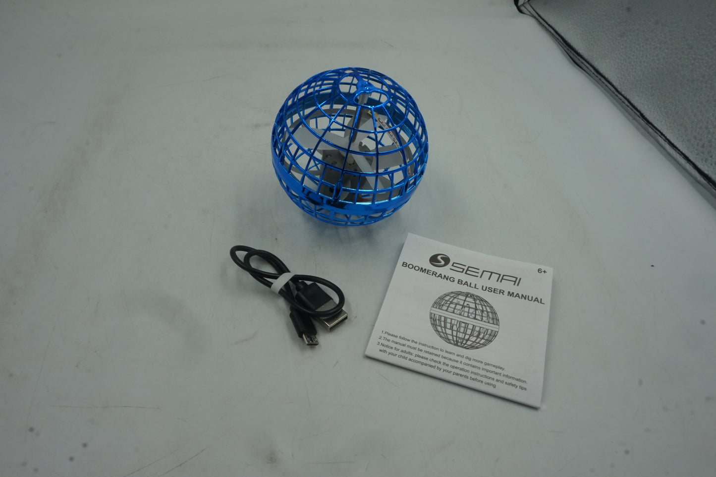 Semi boomerang flying orb ball