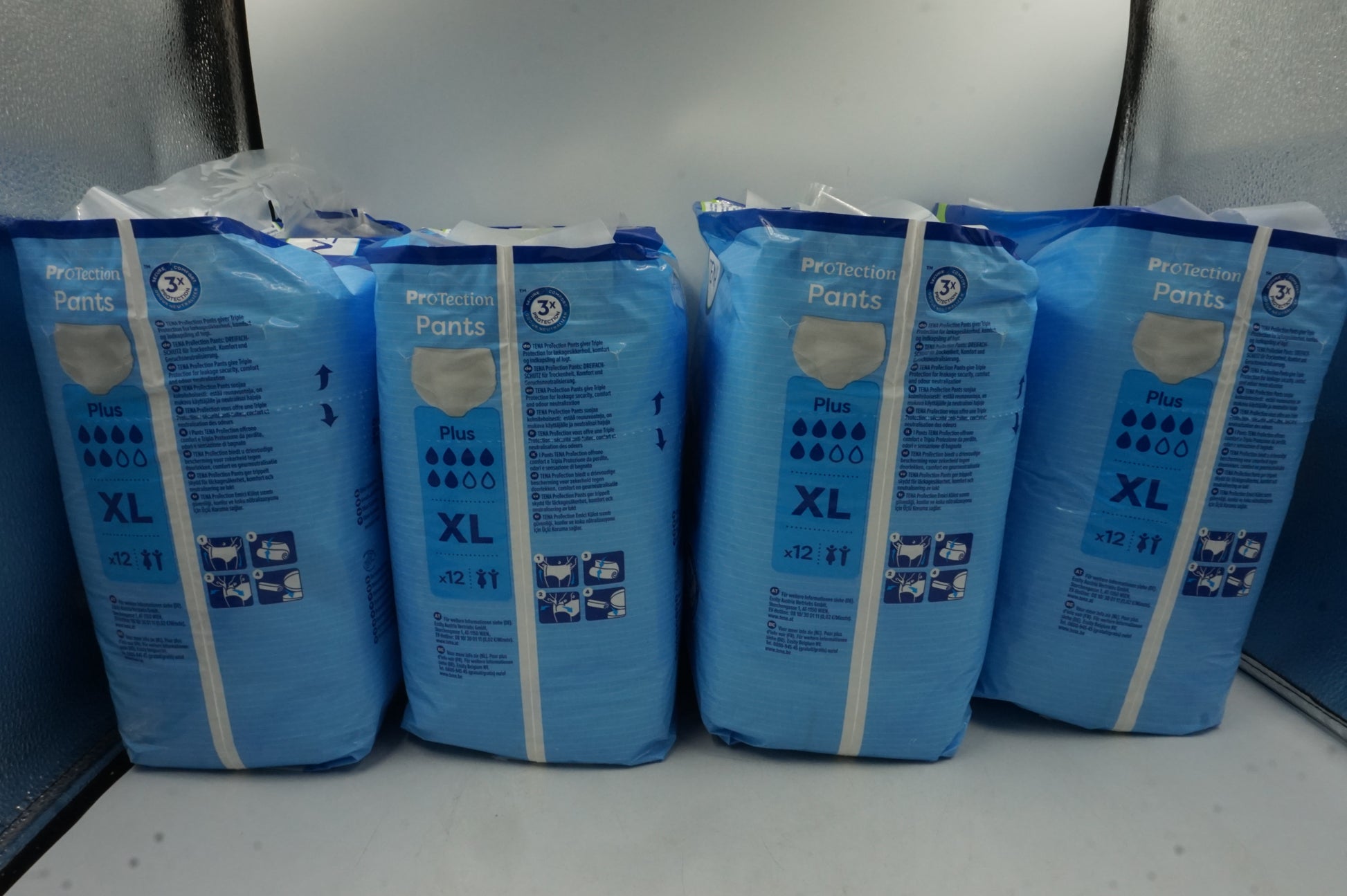 pack of 4 unisex 3x protection TENA protection pants plus XL X12