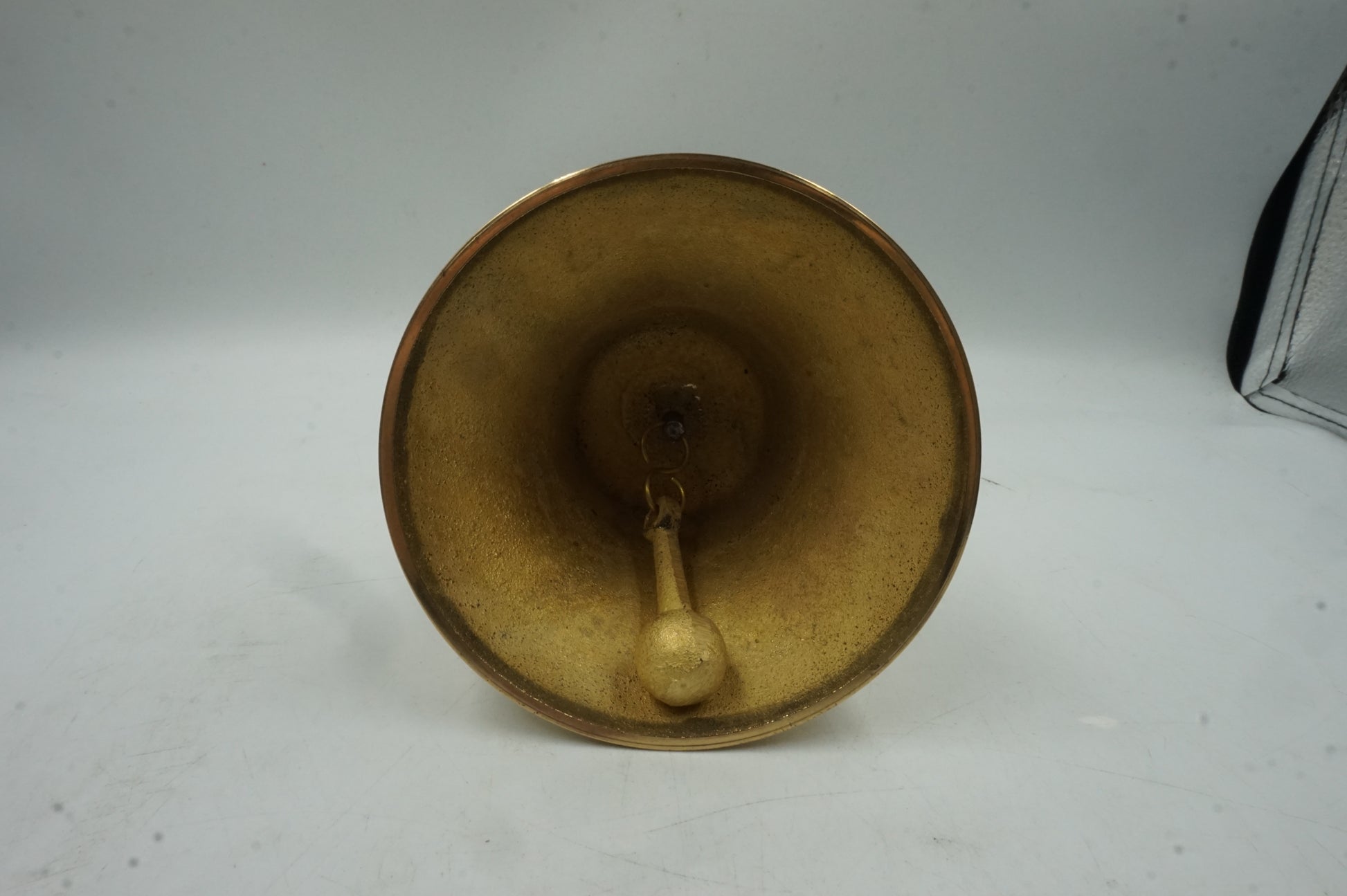 handheld brass bell with wooden handle