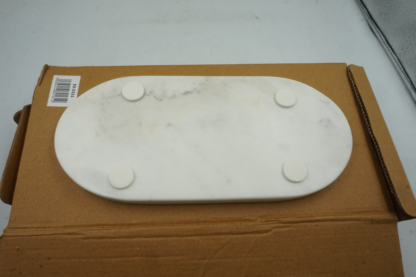 white marble oval bathroom tray